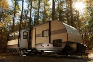 A small image of an RV in woods