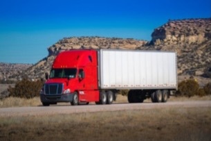 A small image of a tractor with trailer